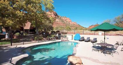 A cozy forest-side chalet with beautiful views of Sedona's red rocks.