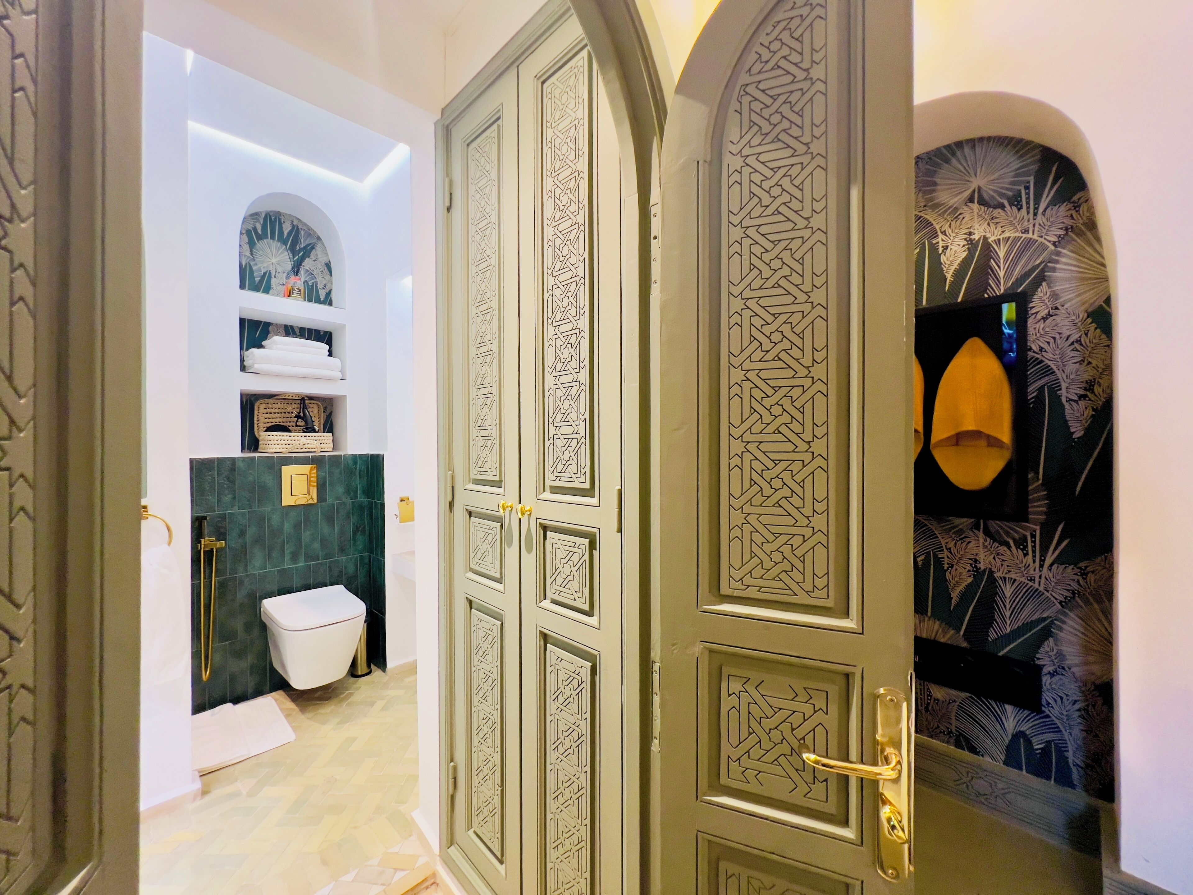 A traditional bathroom with a toilet, a sink, and a shower area.