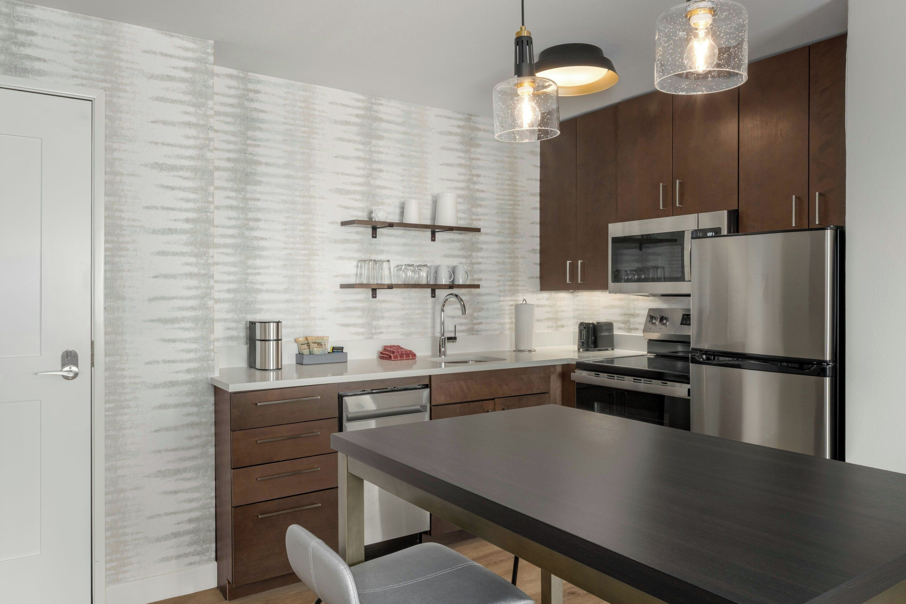 Suite, 2 Bedrooms | Desk, laptop workspace, blackout drapes, iron/ironing board