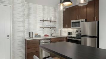 Suite, 2 Bedrooms | Desk, laptop workspace, blackout drapes, iron/ironing board