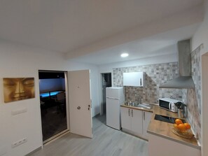 Fridge, microwave, stovetop, coffee/tea maker