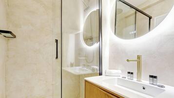 Shower, hair dryer, towels, shampoo