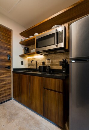 Full-sized fridge, microwave, stovetop, coffee/tea maker