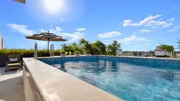 2 outdoor pools, pool umbrellas, pool loungers