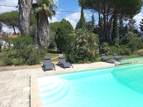 Large villa with 11x5m pool in 7700 M2 grounds. Veranda and multiple terraces.