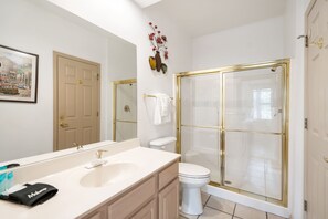 Shower, hair dryer, towels, shampoo