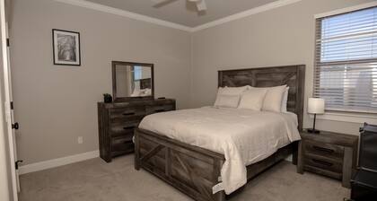 This spacious retreat features 5 bedrooms, 2 futons, and 2 reclinable couches