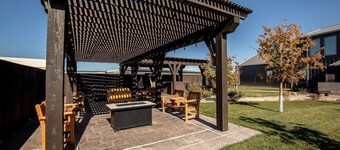 This spacious retreat features 5 bedrooms, 2 futons, and 2 reclinable couches