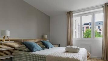 1 bedroom, desk, iron/ironing board, travel crib