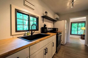 Fridge, microwave, stovetop, coffee/tea maker