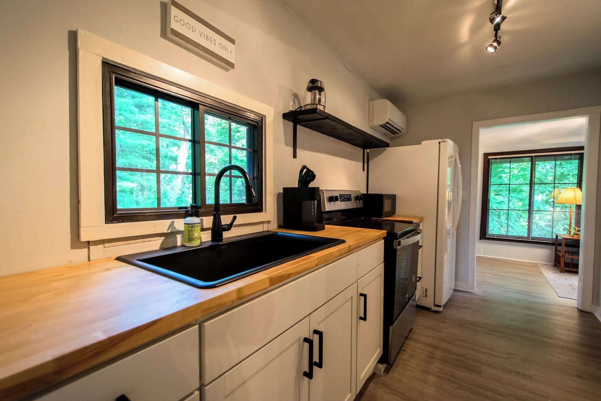 Fridge, oven, coffee/tea maker, cookware/dishes/utensils