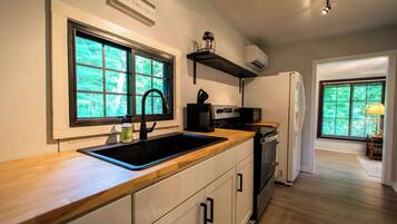 Fridge, oven, coffee/tea maker, cookware/dishes/utensils