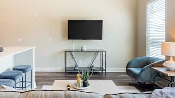 Apartment, 2 Bedrooms | Living area | 50-inch TV with digital channels