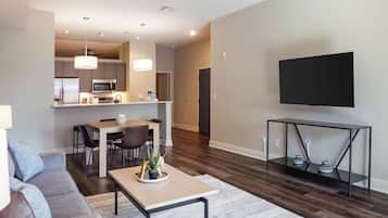 Apartment, 1 Bedroom | Living area | 50-inch TV with digital channels