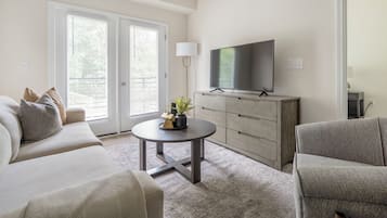Apartment, 2 Bedrooms | Living area | 50-inch TV with digital channels