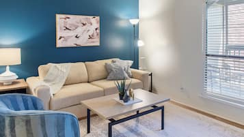 Apartment, 1 Bedroom | Living area | 50-inch TV with digital channels