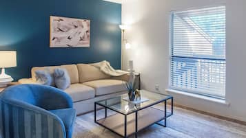 Apartment, 2 Bedrooms | Living area | 50-inch TV with digital channels
