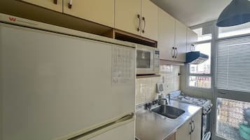 Apartamento, vista para a cidade | Cozinha privada