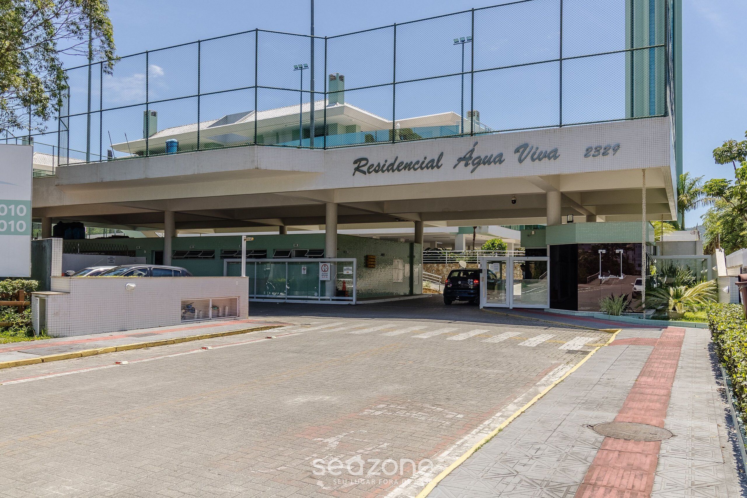 A building with a sign reading "Residential Aqua Viva 2329".