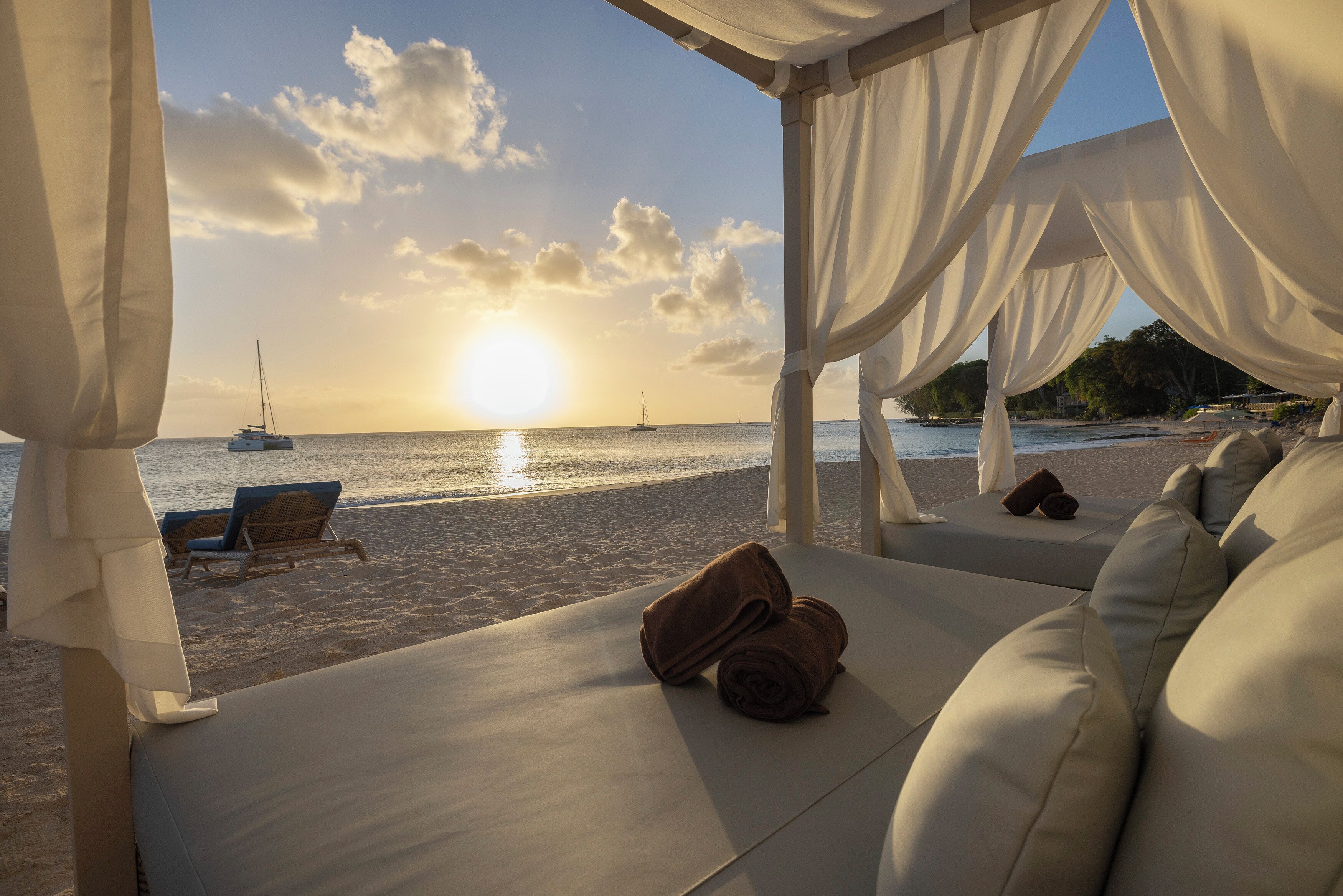 On the beach, beach cabanas, beach umbrellas, beach towels
