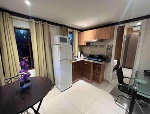 Fridge, microwave, stovetop, coffee/tea maker