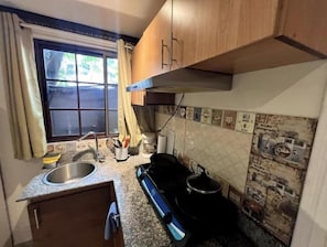 Fridge, microwave, stovetop, coffee/tea maker