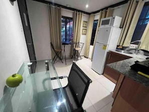 Fridge, microwave, stovetop, coffee/tea maker