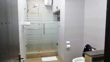 Shower, towels, soap, toilet paper