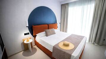 Deluxe Room, Patio | Minibar, in-room safe, individually decorated, individually furnished