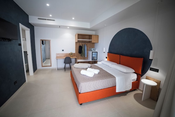 Superior Triple Room, Pool View | Minibar, in-room safe, desk, blackout drapes