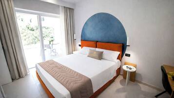 Deluxe Room, Patio | Minibar, in-room safe, individually decorated, individually furnished