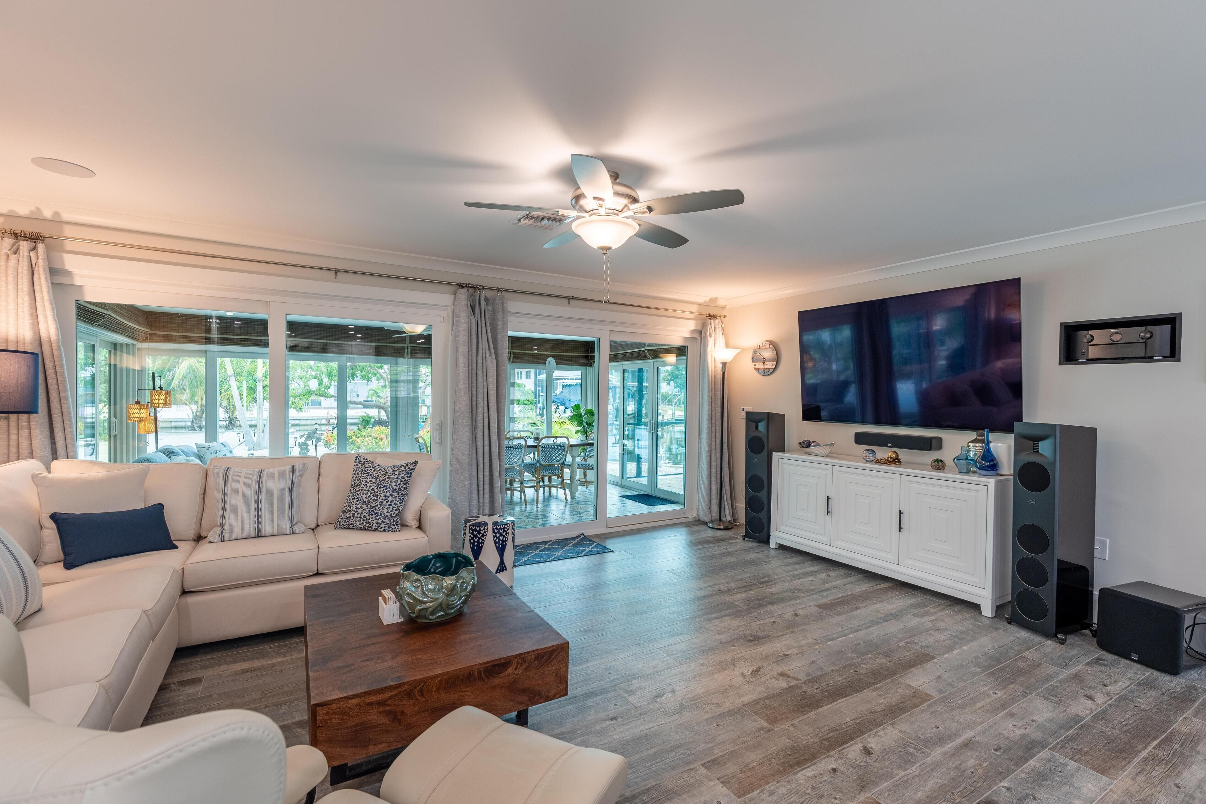 A modern living room with a sofa, coffee table, and TV.