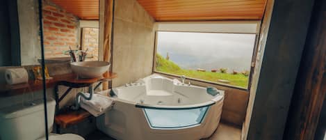 Jetted tub, hair dryer, towels, soap