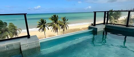 Outdoor pool, pool umbrellas, sun loungers