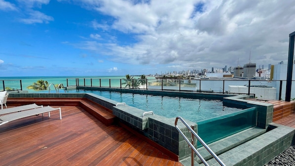 Outdoor pool, pool umbrellas, sun loungers