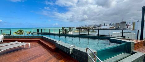 Outdoor pool, pool umbrellas, pool loungers