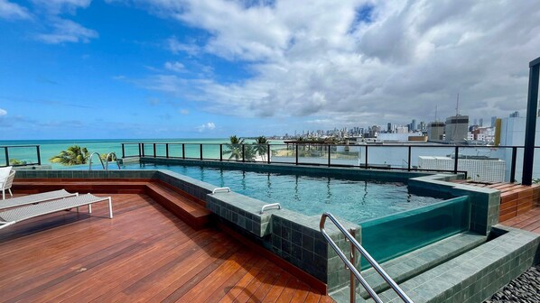 Outdoor pool, pool umbrellas, pool loungers