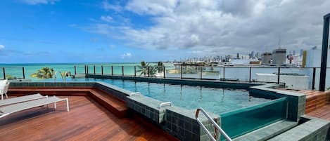 Outdoor pool, pool umbrellas, pool loungers