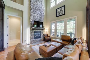 TV, fireplace, books