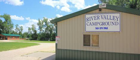 A small building labeled 'River Valley Campground' with a contact number.