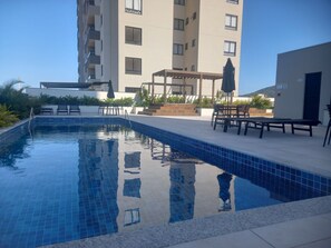 Deluxe Apartment, Pool Access, Beach View | Pool | Outdoor pool, pool loungers