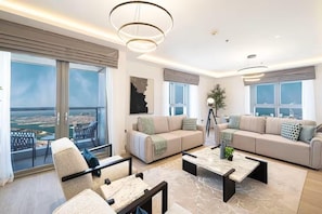 Premium Apartment, Balcony, Ocean View | Living area | Flat-screen TV