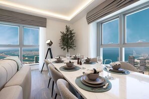 Premium Apartment, Balcony, Ocean View | In-room dining