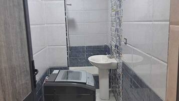 Shower, towels, soap, toilet paper