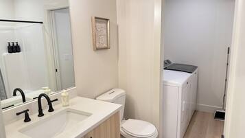 Shower, hair dryer, towels, soap