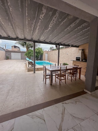 Porch. Casa Paraíso em Família - Praia Grande