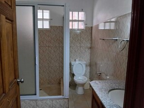 Shower, towels, soap, toilet paper