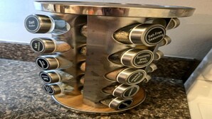 A salt dispenser with multiple compartments for different types of salt.
