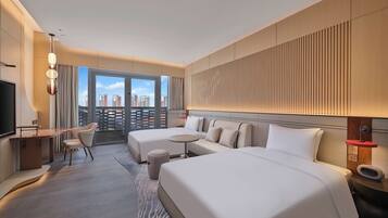 Premium bedding, down duvets, Select Comfort beds, free minibar