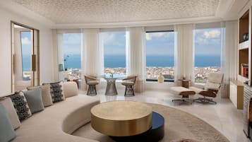 Suite Premium, 1 chambre, vue baie | Coin séjour | Cheminée, chauffage par le sol, enceintes connectées